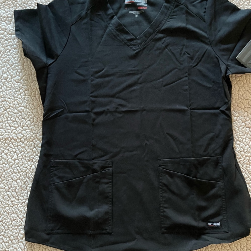 Grey’s anatomy size medium 4pocket scrub top. Brand new